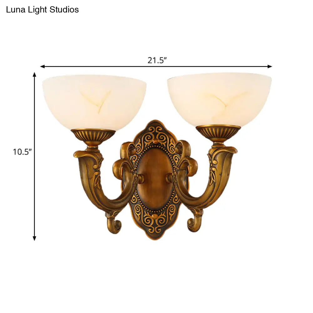 Rustic Brass Wall Sconce With Frosted Glass Shade - Swooping Arm Design For Ambient Lighting