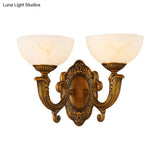 Rustic Brass Wall Sconce With Frosted Glass Shade - Swooping Arm Design For Ambient Lighting