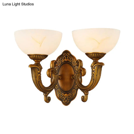 Rustic Brass Wall Sconce With Frosted Glass Shade - Swooping Arm Design For Ambient Lighting