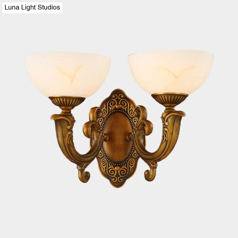 Rustic Brass Wall Sconce With Frosted Glass Shade - Swooping Arm Design For Ambient Lighting