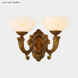 Rustic Brass Wall Sconce With Frosted Glass Shade - Swooping Arm Design For Ambient Lighting