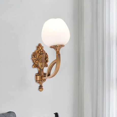 Rustic Flower Wall Mounted Lamp: 1-Light Cream Glass Sconce In Brass With Carved Backplate