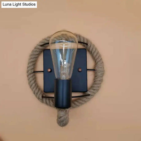 Rustic Indoor Wall Light With Wagon Wheel Design And Rope Shade