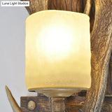 Rustic Resin Antler Wall Mount Light With Handblown Glass Shade - Brown