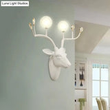 Rustic Resin Sconce Light With Deer Deco - Wall Mounted Lamp For Living Room 2 Lights Black/White