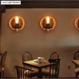 Rustic Rope Wall Sconce With Bare Bulb Design And Wood Detailing