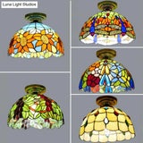Rustic Tiffany Stained Glass Flush Light With Nature-Inspired Pattern And Antique Brass Finish