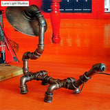 Rustic Wrought Iron Dog Shaped Table Lamp With Industrial Pipe Design - 1 Light Flat Shade Perfect