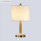 Simple Metal Cylindrical Nightstand Light With 1-Light White Fabric Lampshade For Living Room