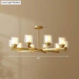 Sleek Brass Cylindrical Hanging Lamp With Clear And Frosted Glass Minimalistic Dining Room
