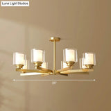Sleek Brass Cylindrical Hanging Lamp With Clear And Frosted Glass Minimalistic Dining Room