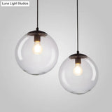Sleek Clear Glass Spherical Pendant Light - Single Bulb Black Suspended Fixture