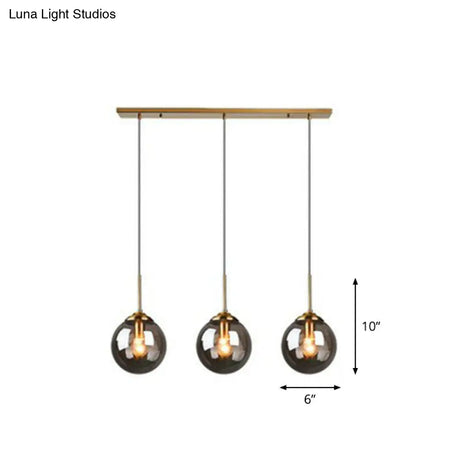 Sleek Glass 3-Bulb Brass Suspension Pendant Light For Minimalistic Dining Room Decor
