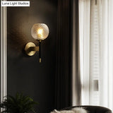 Sleek Glass Globe Wall Sconce: Ribbed Simplicity Brass Finish Mounted Light Fixture