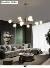 Sleek Modos Chandelier: Simplicity White Glass Ceiling Light With Brass Finish For Living Room