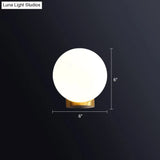 Sleek Opal Glass Wall Mount Lamp - Brass Bedside Sconce Light (1 Bulb)