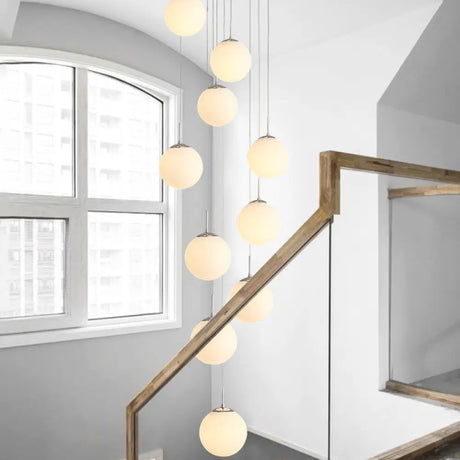 Sleek Silver Staircase Pendant Light With Cream Glass Shades - 10 Head Cluster Design