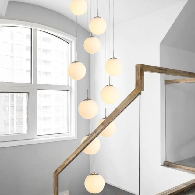 Sleek Silver Staircase Pendant Light With Cream Glass Shades - 10 Head Cluster Design