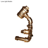 Small Brass Sitting Robot Desk Light Industrial Metal Bedside Table Lamp With Cord
This Revised