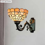 Tiffany Orange Shell Wall Sconce With Curved Arm And Bowl Shade