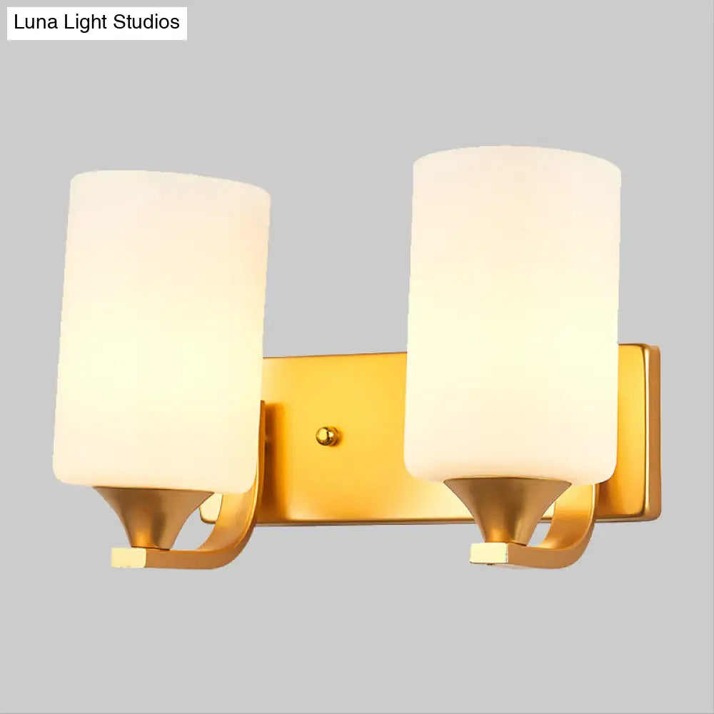 Traditional 2-Bulb Gold Wall Lamp With Milky Glass Cylindrical Fixture
