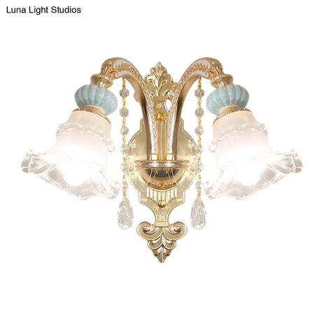Traditional Blue Frosted Glass Wall Sconce With Ceramic Accent And Ruffle Trim