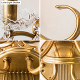 Traditional Crystal Candle Wall Sconce With Antiqued Brass Finish And Scroll Arm