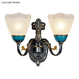 Traditional Wall Mount Sconce Lamp With Ribbed Glass And Curvy Arm Design