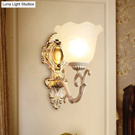 Vintage Brass/Beige Frosted Ribbed Glass Wall Sconce Lamp With Curvy Arm - 1 Light Bloom