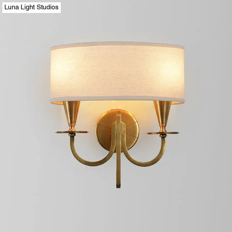 Vintage Brass Cylinder Wall Sconce With Fabric Shade And Arched Metal Arm - Ideal For Bedroom