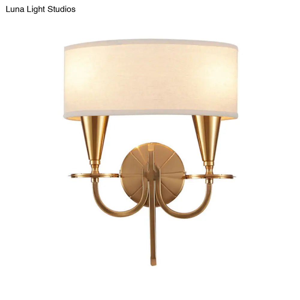 Vintage Brass Cylinder Wall Sconce With Fabric Shade And Arched Metal Arm - Ideal For Bedroom