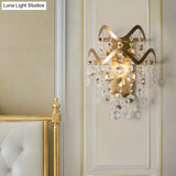 Vintage Brass Led Wall Sconce With Crystal Strand Draping And Waveform Edge