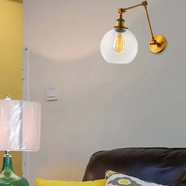 Vintage Brass Sconce: Clear Glass Spherical Lighting Fixture For Bedroom