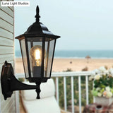 Vintage Clear Glass Wall Sconce: Tapered Single-Bulb Courtyard Lamp