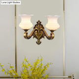 Vintage Curved Arm Brass Wall Lamp With Flower Milk Glass Shade