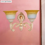 Vintage Curved Arm Metal Wall Lamp: 1/2-Head Sconce With Beige Glass Shade For Living Room