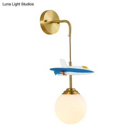 White Glass Globe Wall Light With Cartoon Plane Decor - 1-Light Fixture