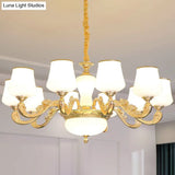 White Glass Gold Chandelier With Tapered Drop Pendant And Scrolled Arm Design