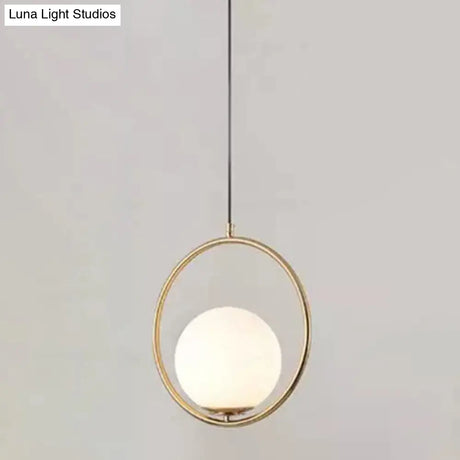 White Glass Pendant Light With Mid-Century Globe Design And Metal Ring